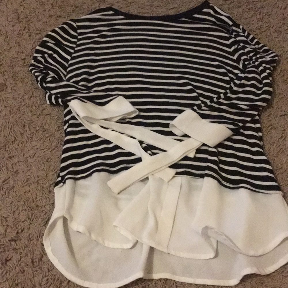 A black shirt with white strings really cool shirt